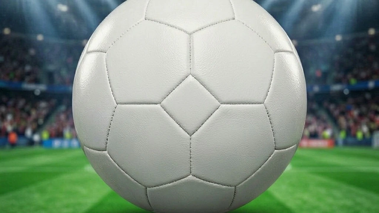 A ball on the turf under floodlights, the object the record is counted with